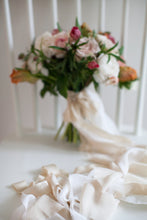 Load image into Gallery viewer, a compact bridal bouquet, wrapped in a luxuriously long cream silk streamer