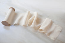 Load image into Gallery viewer, Wide ivory silk ribbon on a spool, displayed on a marble surface
