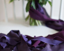 Load image into Gallery viewer, rich purple and violet silk ribbon in the foreground and a beautiful wedding bouquet in the background