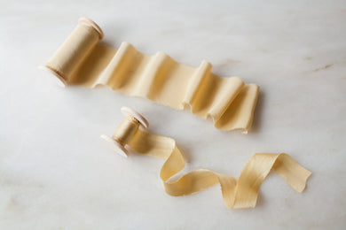 Handmade and hand dyed yellow silk ribbon by the yard and on a wooden spool